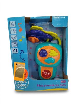 des jouets dans une boîte bleue contenant une petite voiture et une paire de ciseaux