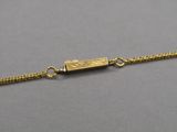a gold plated bracelet with a small rectangular clasp