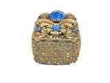an image of a gold ring with a blue stone in the center