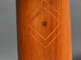 an image of a wooden pedestal with a clock on top of it