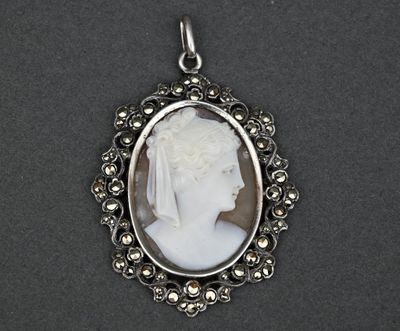 a close up of a picture of a woman ' s face in a silver frame