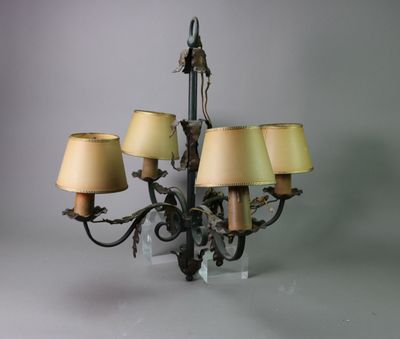 a chandelier that has five lamps on it