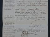 an old document with writing on it sitting on top of a table