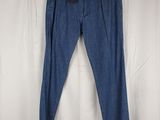 a pair of blue jeans on a hanger on a white background
