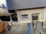 a close up of a hospital bed with a sign on it