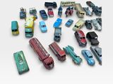 a lot of toy cars that are on a white surface