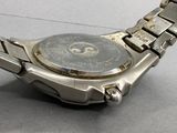 a close up of a watch on a table