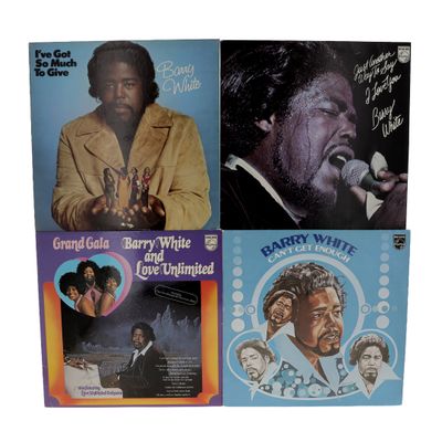 three vinyl albums of various black and white music, including one with a microphone and one with a microphone