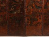 an old wooden screen with a design on the top and bottom of it