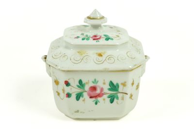 a small white box with a flower design on it