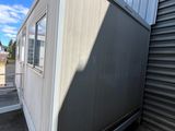 an image of a mobile home with a door open