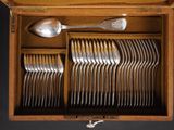 a wooden box filled with silverware and spoons