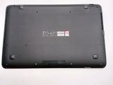 a black laptop with a red sticker on the back of it