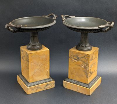 pair of marble pedestals with metal handles and handles
