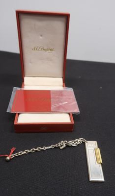 an image of a red and white box with a chain attached to it