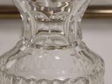 a clear glass vase sitting on top of a table