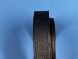 a black leather belt on a blue background