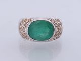 an emerald and diamond ring