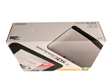 a box with a laptop inside of it on a white surface