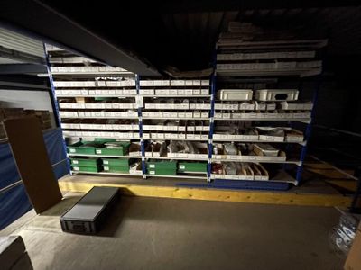 a room filled with shelves and boxes of assorted items