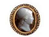 a picture of a picture of a woman ' s head in a broochle