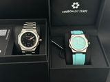 pair of watches in a box on display in a store
