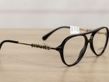 a close up of a pair of glasses on a wooden table