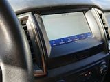 the dashboard of a car with a gps device on the dashboard