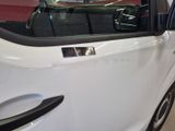 a white car that is parked in a garage