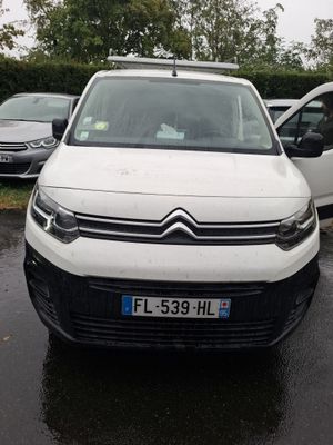 a white van that is parked in a parking lot