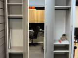 an image of a room with a closet and a desk