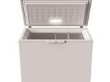 a white chest freezer sitting on top of a white surface