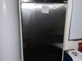 a refrigerator and a water heater in a small room