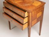 three wooden drawers are stacked on top of each other on a table