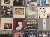 a lot of records on the floor of this room