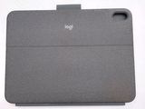 the back of a gray ipad case sitting on top of a white table
