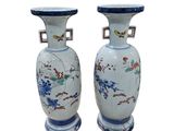 pair of chinese vases with birds and flowers painted on them