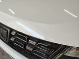 a close up of a car ' s grille and front bumper