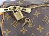 a close up of a purse with a lock on it