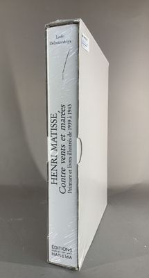 a white box with a book on it sitting on a table
