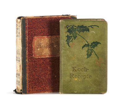 an old book sitting on top of a table next to a book
