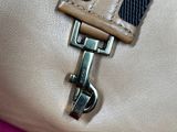 a close up of a purse with a strap on it