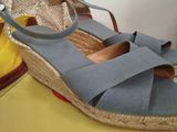 a pair of shoes that are on a yellow table