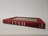 a red book sitting on top of a white table