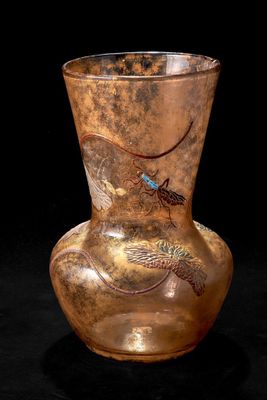 a vase that has a bird on it on a black background