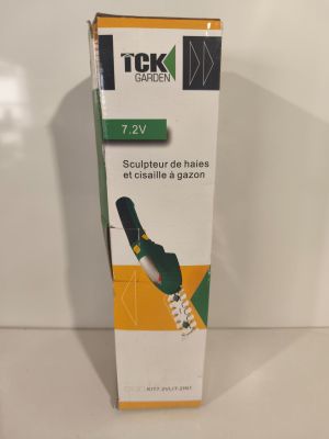 box of toothbrushes sitting on a white surface with a green and yellow stripe