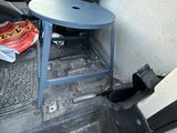 a small table and chair in the back of a van