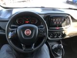 the dashboard of a car with a steering wheel and dashboard controls