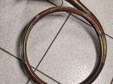 a horn and a tube on the floor in a room