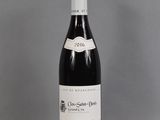 a bottle of wine that is sitting on a table